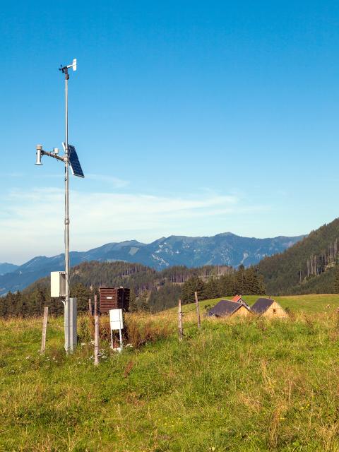 Measuring devices from a weather station are located on an alpine meadow on the Ebenforstalm