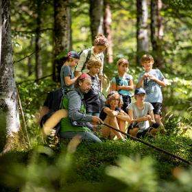 National Park ranger with a group of schoolchildren in the forest