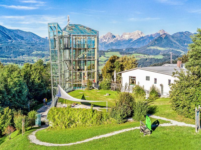 Glass observation tower with mountain panorama