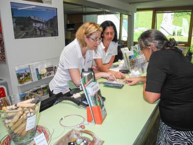 Two National Park employees advise a visitor